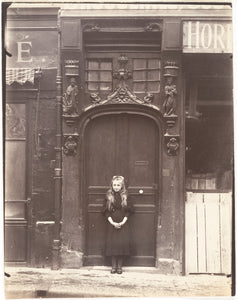 Eugene Atget - Young Girl Infront of Door Rouen rue Eau-de Robac Paris, France (1908) - 17"x22" Fine Art Print