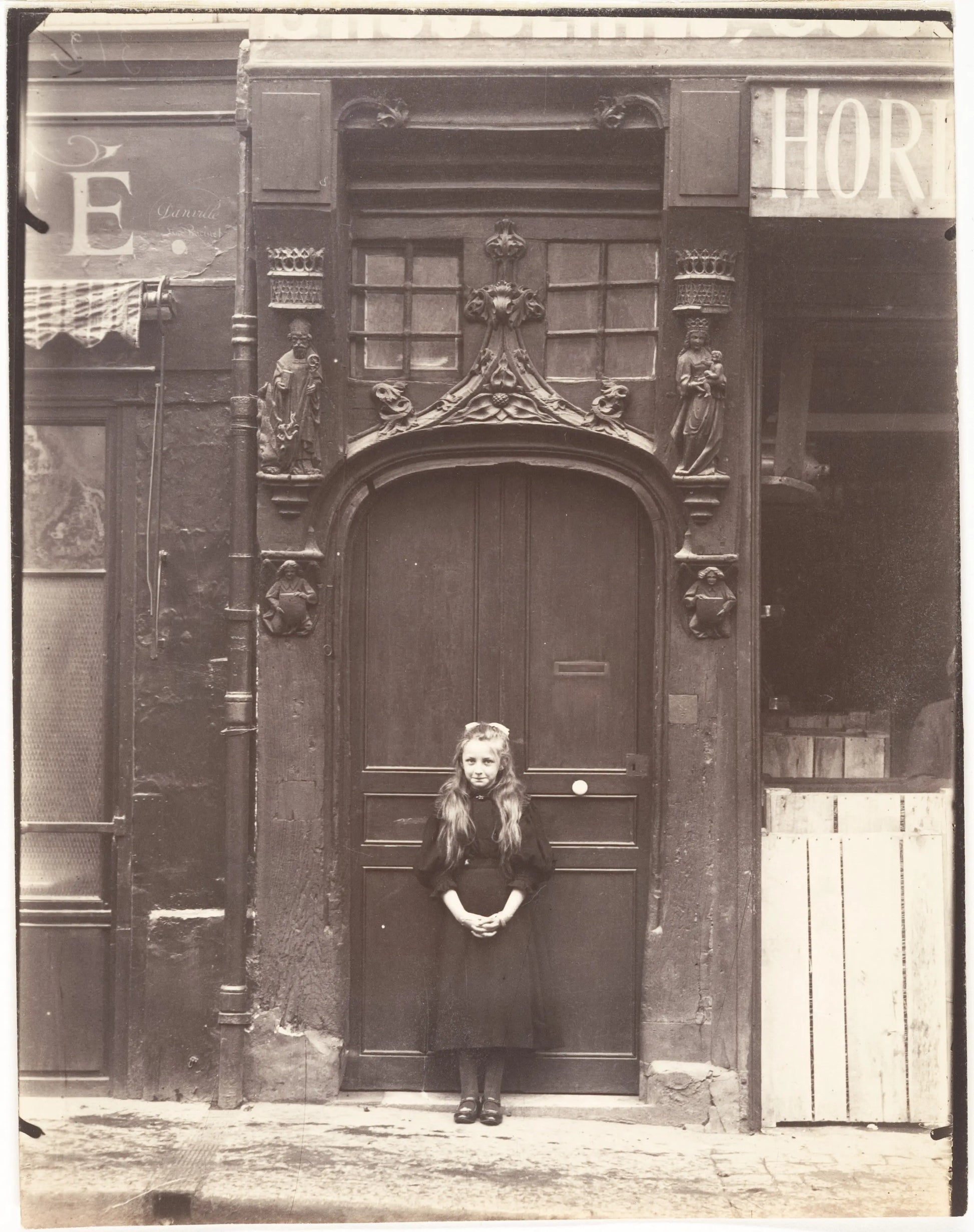 {{ product_title }} Fine Art Print | {{ product_vendor }} Jakero77 Eugene Atget - Young Girl Infront of Door Rouen rue Eau-de Robac Paris France (1908) Fine Art Print Art Print  Jakero77