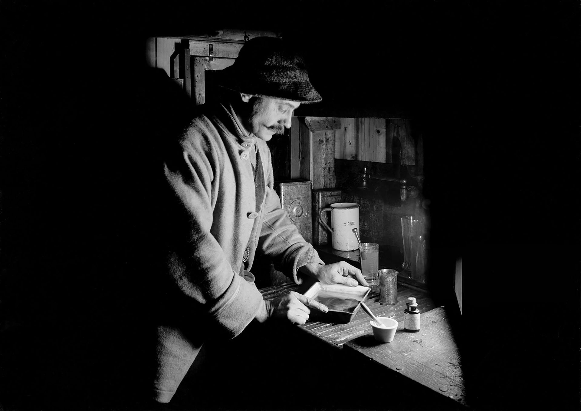 Herbert Ponting in his Makeshift Darkroom, Antarctica (1911) - 17"x22" Art Print