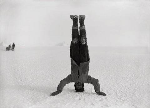 Herbert Ponting - Photographer Headstand Antarctica (1911) - 17" x 22" Art Print